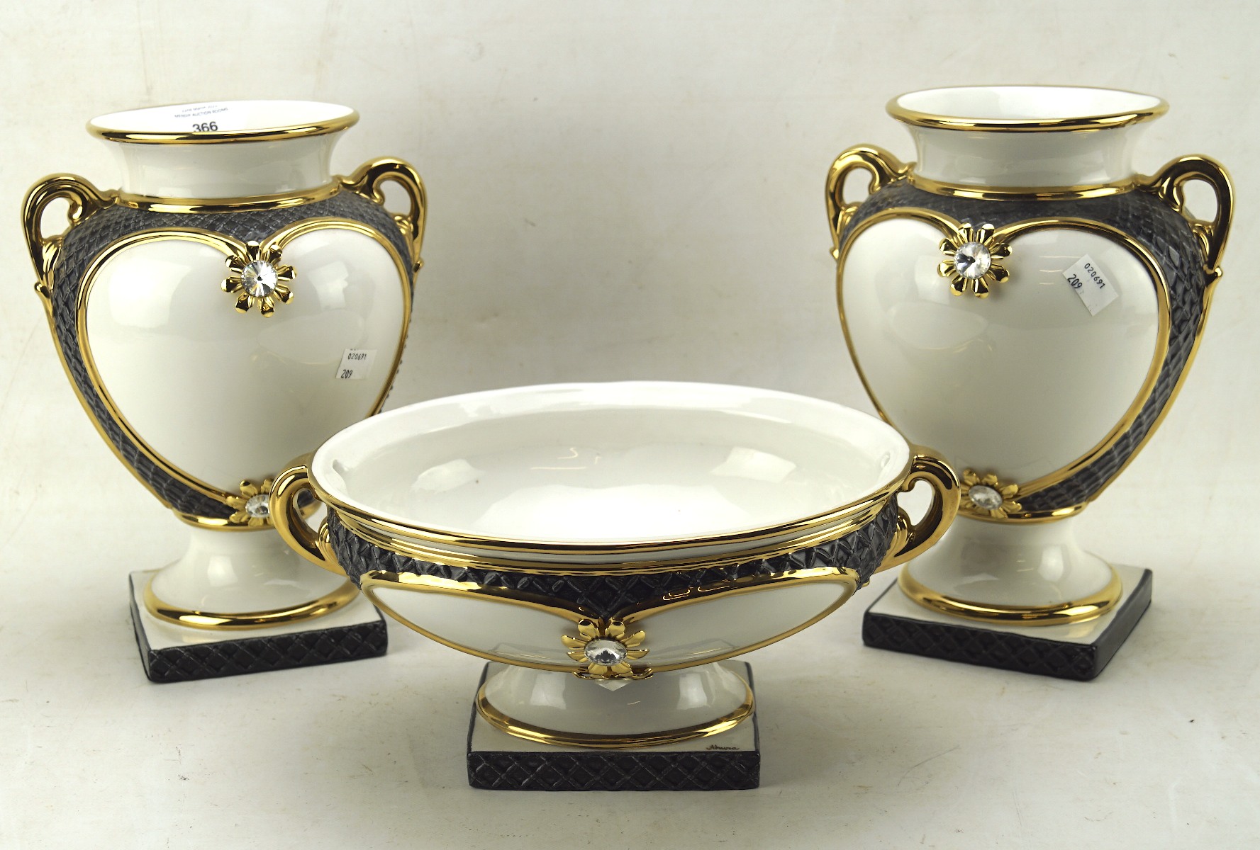 A pair of contemporary ceramic twin handled vases and matching footed bowl,