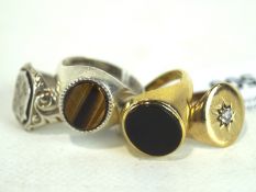 Four 20th century signet rings, including two 9ct gold examples and two silver examples,