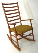 A contemporary beech rocking chair, with seven section ladder back,