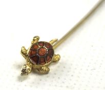 A 20th century lapel pin mounted with enamel inlaid Turtle,