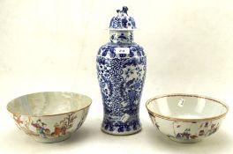 A 19th century Chinese blue and white vase and cover, and two 18th/19th century famille rose bowls