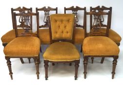 A set of six mahogany framed dining chairs, with carved details and raised on turned supports,