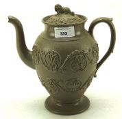 An early 20th century Wedgwood salt glazed teapot, with flowing foliate decoration,