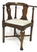 A Victorian mahogany corner chair, with upholholstered seat and front cabriolet support,