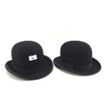 Two black bowler hats,