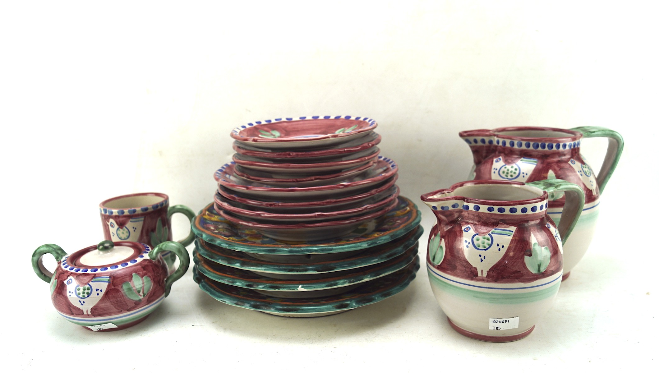 A group of pink ground Italian Solimene pottery including jugs, sugar bowl,