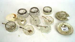 A collection of glass salts, of assorted shapes and designs,