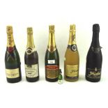 A vintage bottle of Moet and Chandon champagne and other bottles