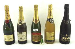 A vintage bottle of Moet and Chandon champagne and other bottles