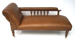 A Edwardian oak leather cover chaise lounge,