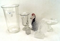 A collection of glass including two vases, a peacock on a stepped base,