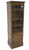 An early/mid 20th century oak display cabinet,