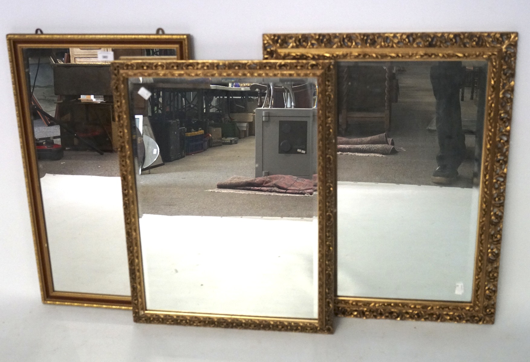 Three gilt framed mirrors, two with pierced foliate designs,