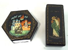 Two 20th century Russian lacquered boxes, one of hexagonal form decorated with a city scene,