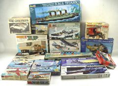 Two boxes of model kits, including a Matchbox 1923 Model-T Ford, Airfix HMS Belfast,