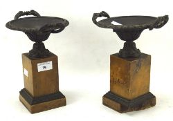 Pair of marble based bronze Gretian style urns with twin fish handles,