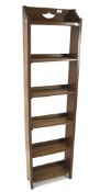 A 1930's oak slimline bookcase, of six shelves,