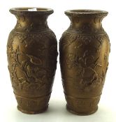 Two 20th century terracotta vases, each with chinoserie decoration, on a gilt ground,