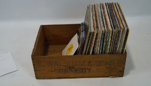 A collection of vinyl, including Acker Bill, Paul McCartney, John Cougar and more,