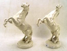 A pair of German Hutschenreuther white glazed ceramic horses, marked K. Tutter 8193,