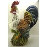 A highly coloured large ceramic model of a cockerel,