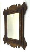 An original arts and crafts mahogany bevelled edge mirror,