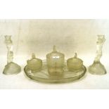An Art Deco colourless glass matched six piece dressing table set decorated with mermaids and fish