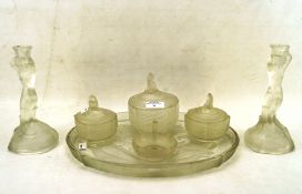 An Art Deco colourless glass matched six piece dressing table set decorated with mermaids and fish