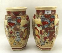 Pair of early 20th century hexagonal Satsuma vases decorated with two reserves of figures,