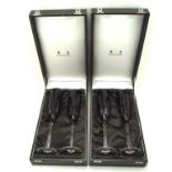 Two pairs of cased Mappin and Webb champagne glasses with black cut design,