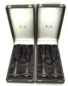 Two pairs of cased Mappin and Webb champagne glasses with black cut design,