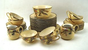 A Japanese export part tea and dinner service, the saffery set including cups and saucers, plates,