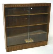 Early 20th century light oak bookcase fitted with slidiing glass doors