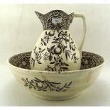 An ironstone Prince jug and basin with brown pattern of fruiting branches on a cream base,