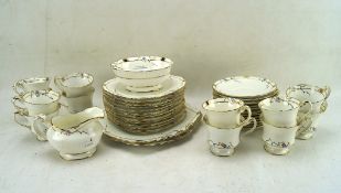 Art Deco Paragon tea set (one cup broken) with blue and yellow flower and gold details,