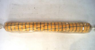 A roll of plaid fabric with blue on a golden yellow ground,