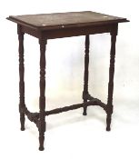 A late 19th/early 20th century oak side table, of rectangular form, raised on turned supports,