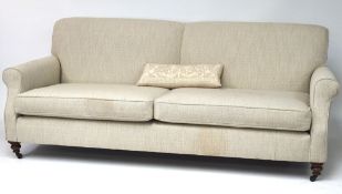 A two seater sofa, with gray and cream patterned upholstery,