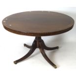 A 20th century mahogany veneer tilt top breakfast table, of circular form,
