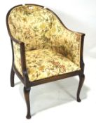 An Edwardian upholstered tub chair,