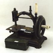 Two vintage sewing machines including a black and gilt 19th century example (AF),