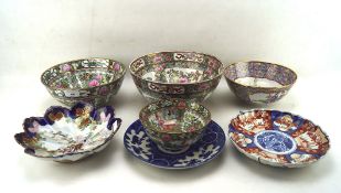 A collection of Chinese and Japanese ceramics inclduing Canton style bowls, largest diameter 26cm,