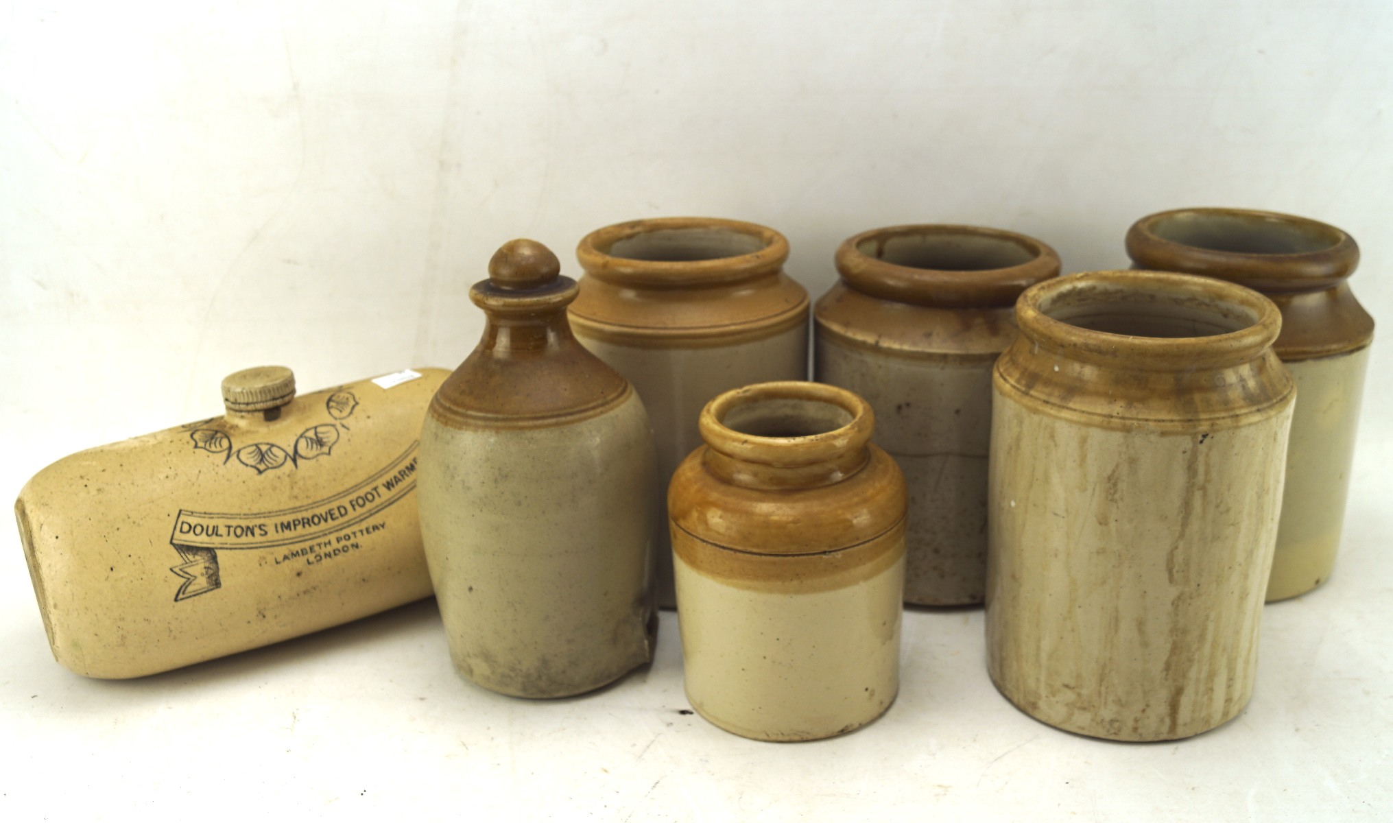 An assortment of 19th century stoneware, including jars,