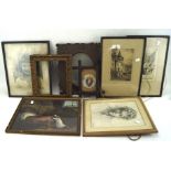 A group of vintage pictures and frames including etchings of city scenes, a drawing of a lady,