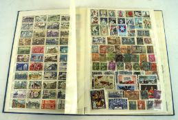 A vintage stock book containing a selection of French stamps,