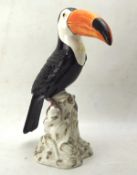 A ceramic sculpture of a toucan