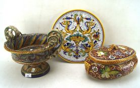 Three pieces of Italian pottery colourfully painted with leaves, fruits and mythological animals,