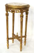 A 20th century gilt wood jardiniere stand, of circular form, with marble top,