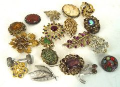 A collection of twenty vintage brooches, of assorted designs,