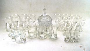 A collection of contemporary drinking glasses and a lidded bonbon dish,